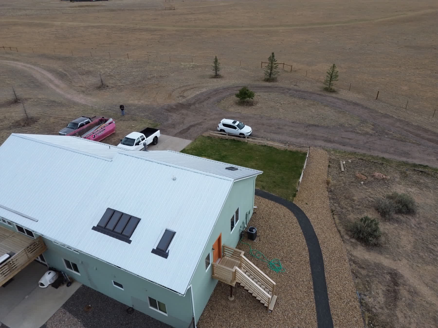 Drone view of a finished rural property roof